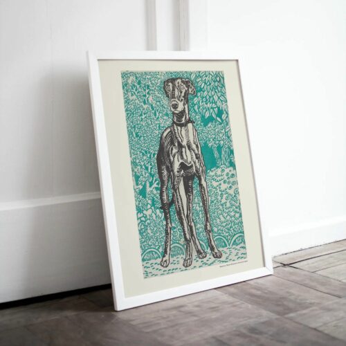 Color woodcut print by Moriz Jung showcasing a detailed illustration of a slender dog, possibly a greyhound or saluki, standing amidst a backdrop of intricate green foliage patterns with small blue dots on the ground.