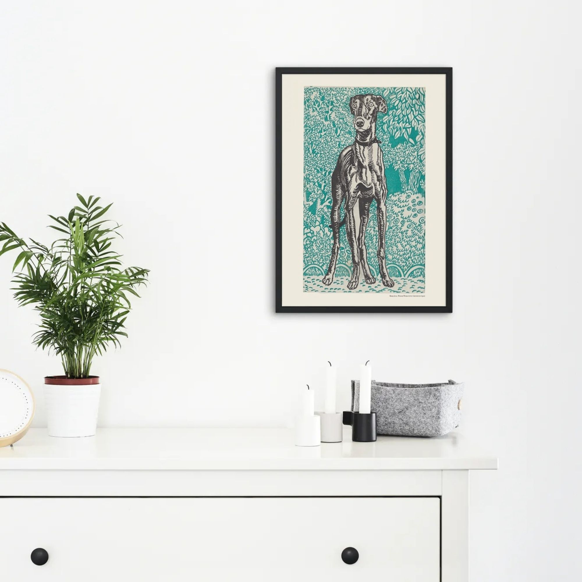 Color woodcut print by Moriz Jung showcasing a detailed illustration of a slender dog, possibly a greyhound or saluki, standing amidst a backdrop of intricate green foliage patterns with small blue dots on the ground.
