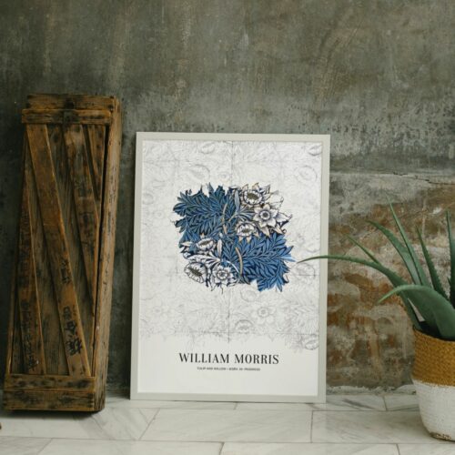 Exquisite vintage William Morris poster 'Tulip and Willow', featuring a rich blue and white botanical print, ideal for those seeking to add a touch of classic Arts and Crafts elegance to their interior design.