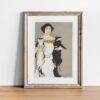 Edward Penfield vintage print of an elegant woman in a white dress holding two cats, one calico and one black and white, exemplifying art nouveau style wall art.