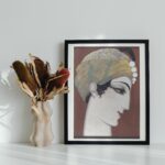 Art Deco portrait by Francois-Louis Schmied, showcasing a man in profile with an ornate turban and a sharp gaze, rendered in warm earth tones with meticulous detail, all beautifully framed in wood.