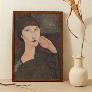 Portrait of Adrienne by Amedeo Modigliani, featuring a poised woman with a characteristic elongated neck and face, and a subdued expression. Her elegant pose, with hand resting gently against her cheek, and the rich, textured background, captures the essence of Modigliani's modernist portraiture.