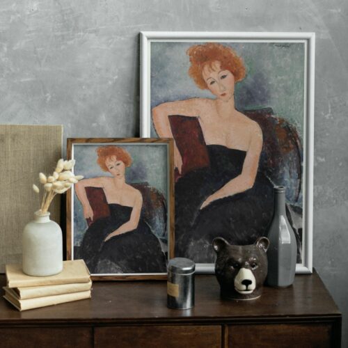 Portrait of a redheaded girl in evening dress by Amedeo Modigliani, depicting a young woman with pale skin and auburn hair styled in loose waves. Her deep, thoughtful gaze and the relaxed pose with one arm resting along the back of a chair showcase Modigliani's distinctive approach to form and emotion. The muted, textured background complements the stark contrast of her dark dress and fair complexion.