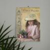 Wall Calendar featuring Camille Pissarro's Impressionist art, showcasing a young girl with a straw hat and a bouquet of flowers.