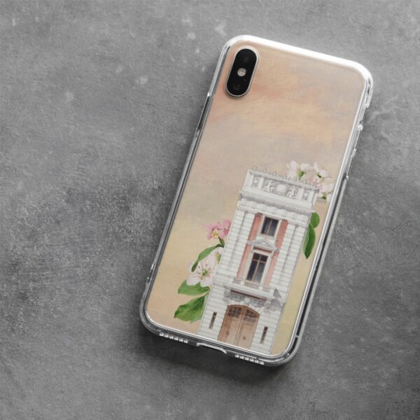 Phone case with a vintage architectural building and blooming flowers illustration, blending classic charm with modern protection for smartphones against a soft sunset background