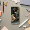 Arthur Rackham art phone case featuring a captivating scene with a young maiden, an elderly woman, and a fearsome wolf in a mystical forest, ideal for art lovers looking to combine device protection with timeless illustration.
