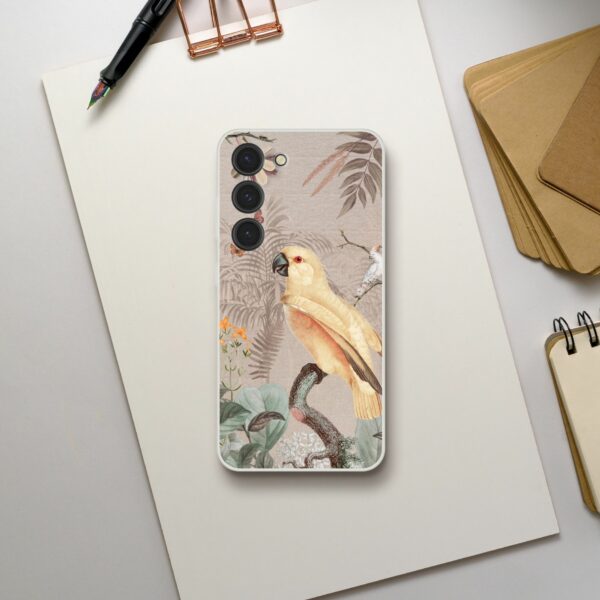 Clear phone case with vintage botanical and bird illustration for iPhone on a grey textured background.