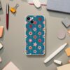 Vibrant teal phone case with a colorful floral pattern, offering a fresh and fashionable look for smartphone protection on a textured grey background