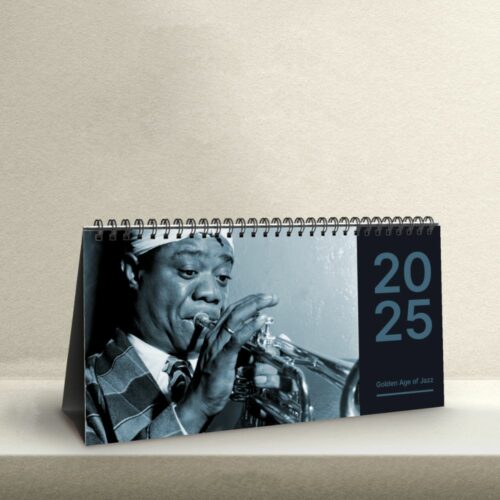 Desk calendar showcasing a black-and-white photo of Louis Armstrong, the iconic jazz trumpeter, capturing the essence of the 'Golden Age of Jazz' with his signature instrument.