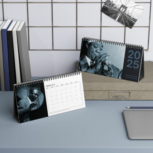 Desk calendar showcasing a black-and-white photo of Louis Armstrong, the iconic jazz trumpeter, capturing the essence of the 'Golden Age of Jazz' with his signature instrument.