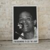 Black and white poster of Al Jarreau smiling as he performs into a microphone, with the caption 'I'm Beginning to See the Light', showcasing the soulful energy of the jazz and pop vocalist.