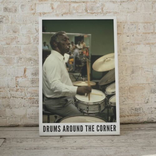 Poster of the influential jazz drummer Art Blakey in mid-performance, titled 'Drums Around the Corner', capturing the intensity and passion of a live jazz session.