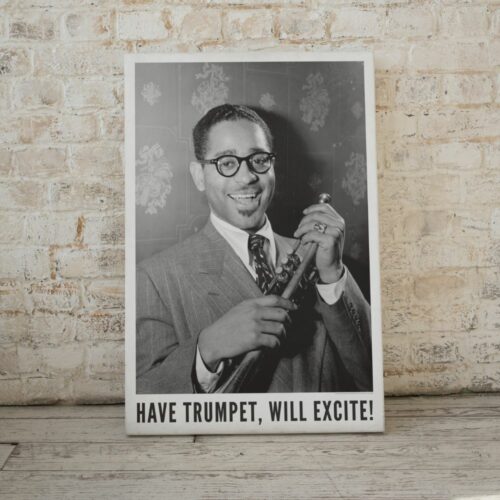 Black and white photo of Dizzy Gillespie with trumpet, cheery expression, titled HAVE TRUMPET, WILL EXCITE!, capturing his lively persona and the vibrancy of jazz.