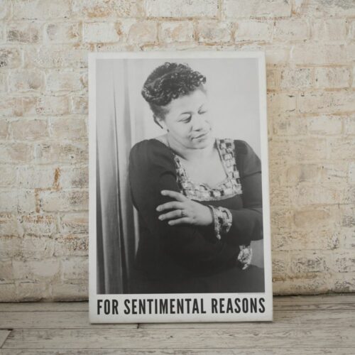 Close-up of Ella Fitzgerald poster with her eyes closed, arms crossed, leaning gently, titled "For Sentimental Reasons.