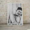 Ella Fitzgerald smiling poster captioned "Like Someone In Love," evoking a joyful, vintage mood.