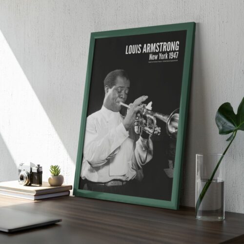Black and white photo of Louis Armstrong playing trumpet, focused and skilled, titled LOUIS ARMSTRONG New York 1947, white shirt, conveying artistry and timeless jazz legacy.