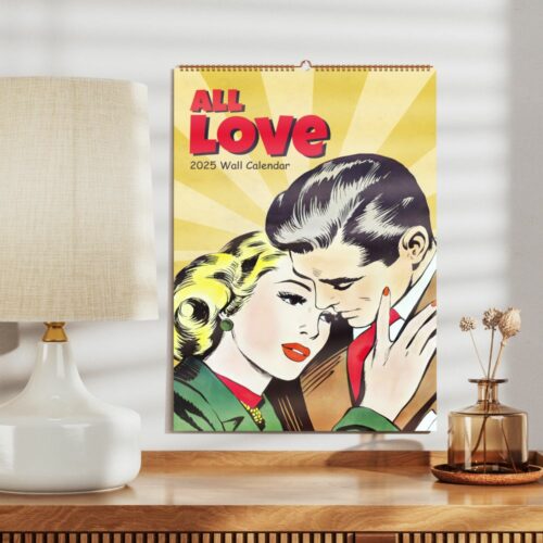 Vintage-style wall calendar for 2025 with a comic book illustration of a couple embracing, placed on a home desk next to a lamp