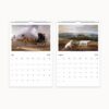 July features a horse-drawn carriage and August presents white dogs in a lush landscape