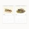 September and October calendar pages showing a small flock of sandpipers in the grass and two game birds amid brown grasses