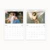 Wall calendar pages for March and April 2025 showcasing neoclassical paintings, one of Cupid and a maiden, and another of Cupid alone, each above a monthly calendar grid.