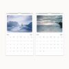 2025 calendar pages for May and June, depicting serene polar landscapes and a shipwreck in the ice.
