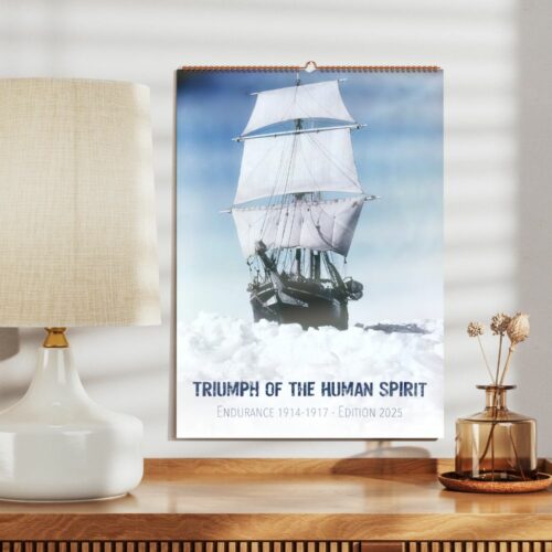 Wall calendar showcasing vintage ship trapped in ice, titled Triumph of the Human Spirit, marking the centennial of the Endurance expedition.