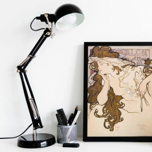 Art Nouveau poster by Mucha featuring a woman with flowing hair and ethereal gown, symbolizing Belle Epoque elegance and design.