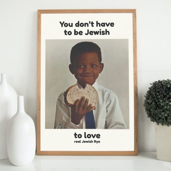 You Dont Have to Be Jewish vintage poster featuring a smiling Black boy holding a slice of rye bread. Iconic 1960s ad campaign promoting Levys Jewish Rye with inclusive messaging. Retro typography, cultural impact, and mid-century advertising design.