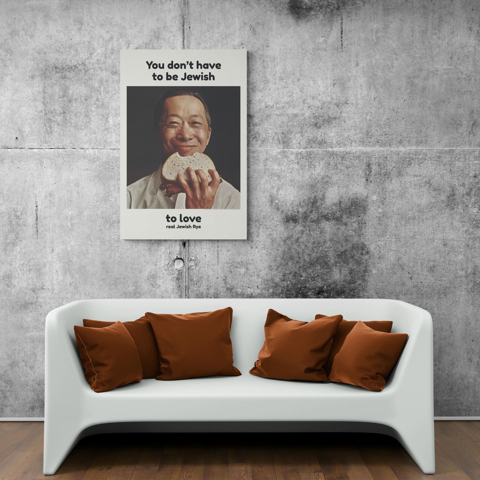 Poster above couch with humorous bread message.