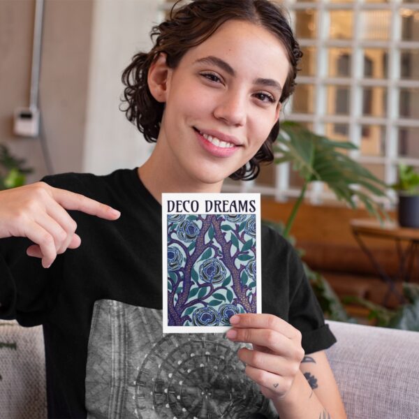 Person holding Deco Dreams art book.