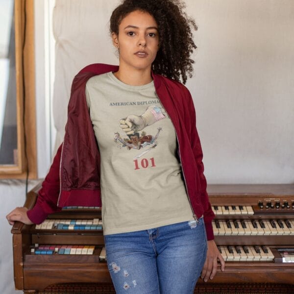 Person in graphic tee by vintage organ keys.