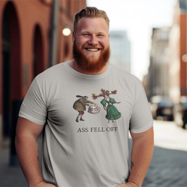 Smiling man wearing humorous t-shirt on a street.