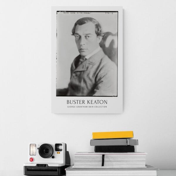 Buster Keaton vintage movie poster featuring a classic black-and-white portrait from the silent film era. Perfect for retro movie decor, classic Hollywood wall art, and film buff collections. A must-have for silent film lovers and vintage cinema enthusiasts.