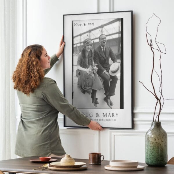 Black and white vintage movie poster featuring silent film stars Mary Pickford and Douglas Fairbanks, part of the George Grantham Bain Collection. Classic Hollywood decor for film enthusiasts and vintage art collectors.