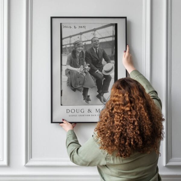 Black and white vintage movie poster featuring silent film stars Mary Pickford and Douglas Fairbanks, part of the George Grantham Bain Collection. Classic Hollywood decor for film enthusiasts and vintage art collectors.