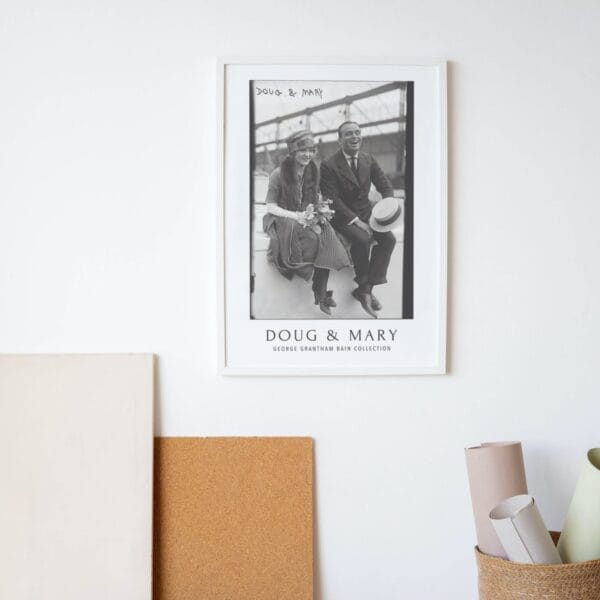 Black and white vintage movie poster featuring silent film stars Mary Pickford and Douglas Fairbanks, part of the George Grantham Bain Collection. Classic Hollywood decor for film enthusiasts and vintage art collectors.