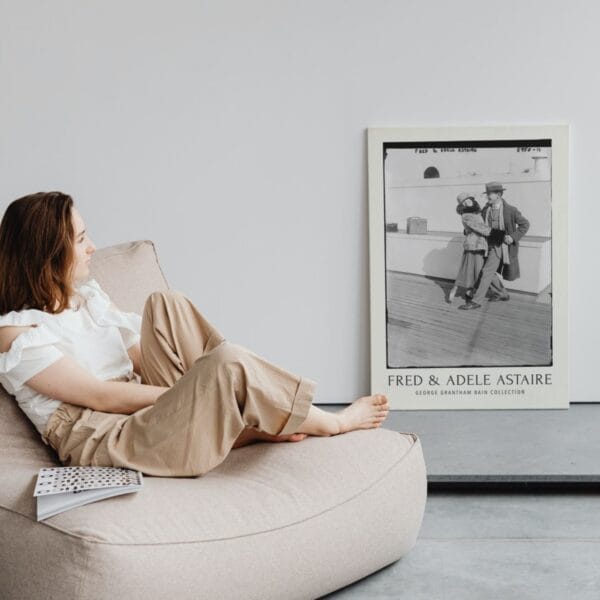 Fred and Adele Astaire vintage black and white print featuring the iconic dance duo on a ship deck, captured in the early 20th century. Classic Hollywood wall art, available as a premium museum-quality print or foam board. Perfect for film history enthusiasts and vintage decor lovers.