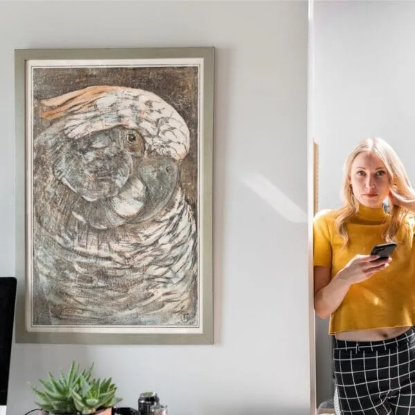 Vintage parrot illustration print featuring intricate details and earthy tones, framed and displayed in various modern and rustic interior settings. A timeless artwork ideal for home decor, bird lovers, and art enthusiasts.