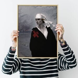 Person holding framed abstract painting of figure with bandage.