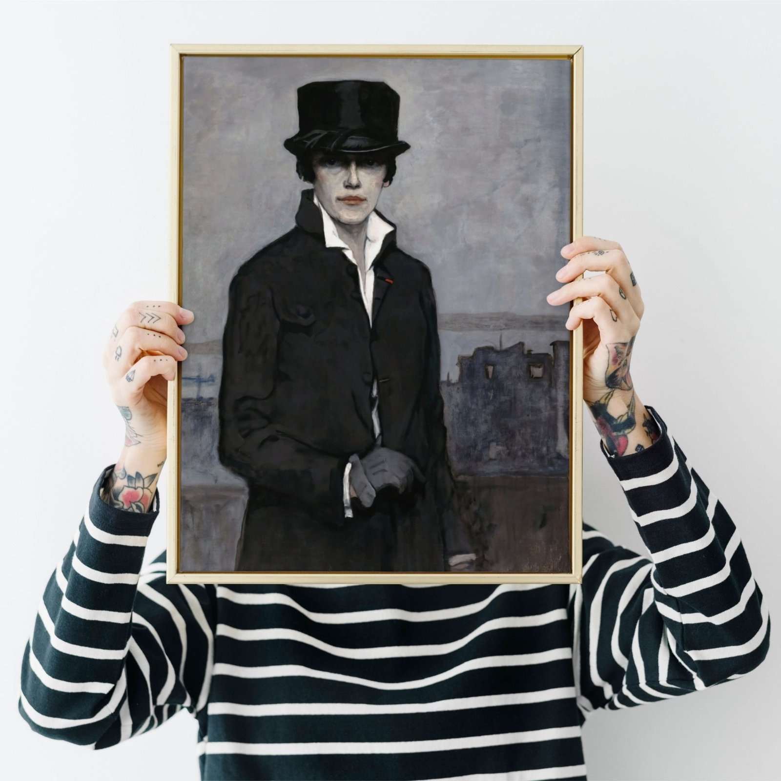 Person holding portrait of gentleman with top hat.