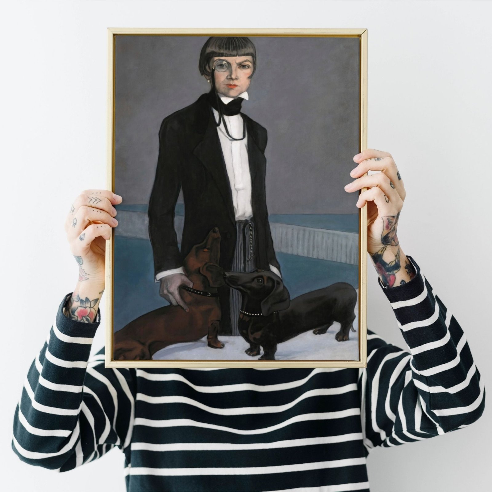 Person holding framed classic painting of a person with dogs.