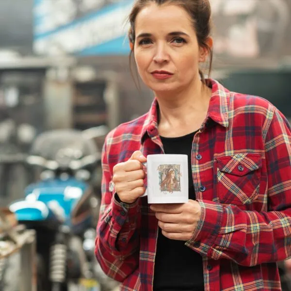 Person holding mug in a workshop setting