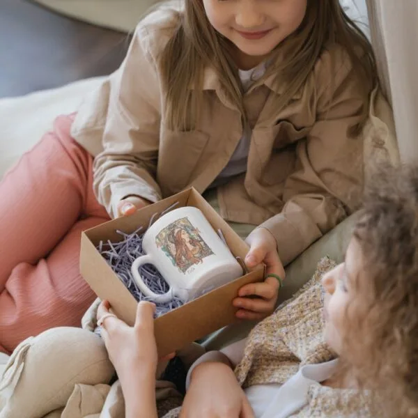 Children exchanging a decorative mug gift box