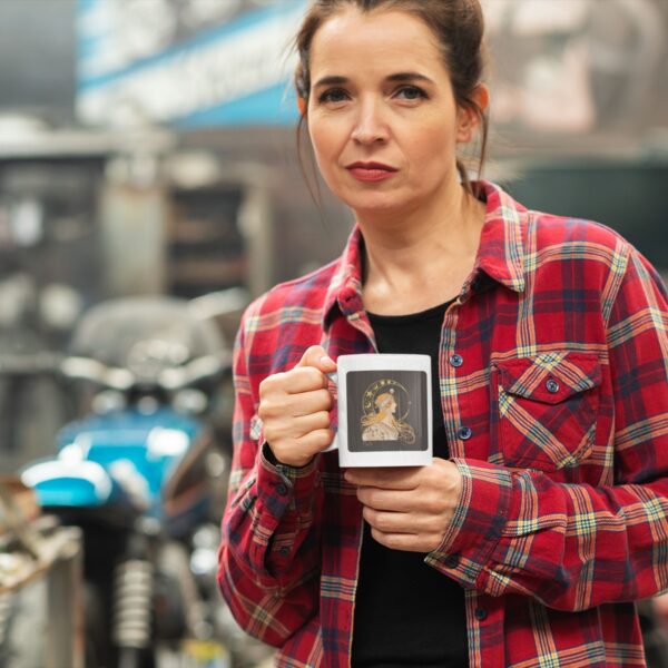 Woman holding coffee mug in garage