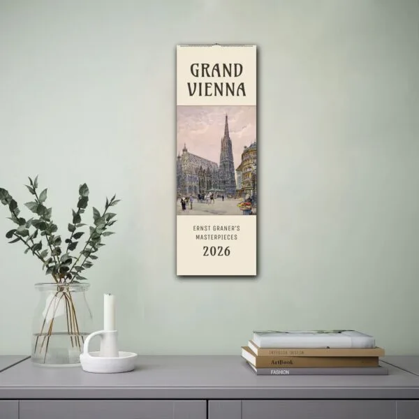 2026 Vienna calendar on wall next to books.