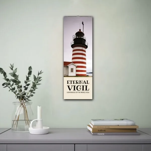 Eternal Vigil lighthouse calendar on wall above desk.