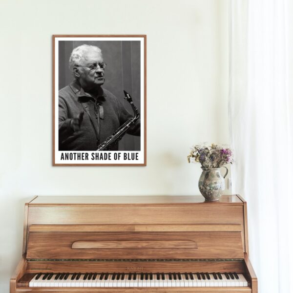 Lee Konitz poster above wooden piano with floral vase.