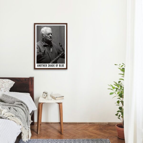 Cozy bedroom with Lee Konitz poster on wall.