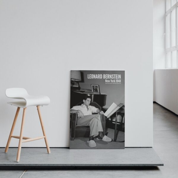 White chair and Leonard Bernstein poster in room