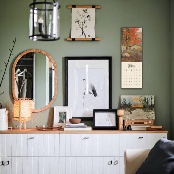 Modern living room with art and October calendar.